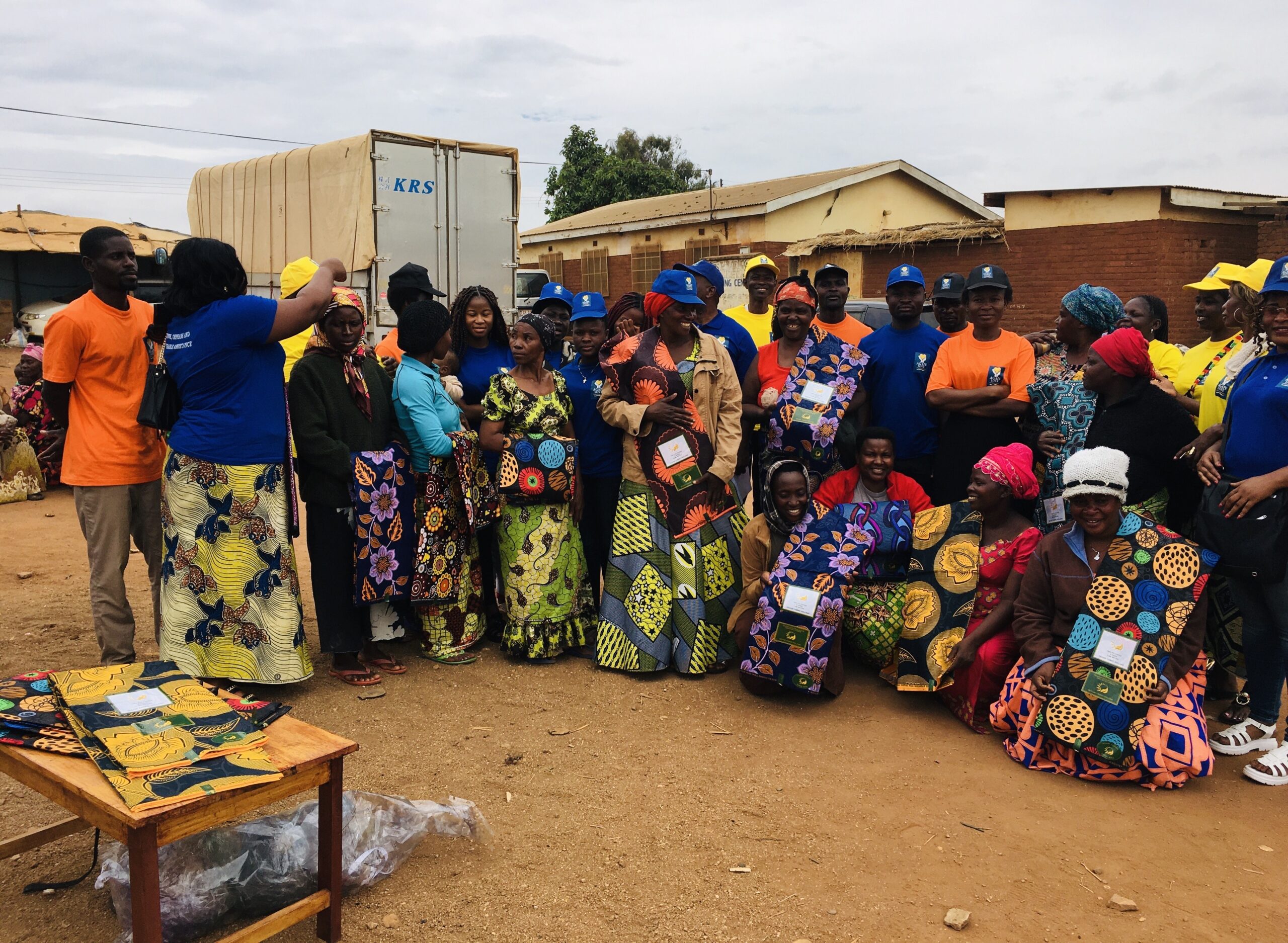 A group of people receiving colorful attire.